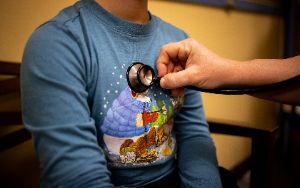  nurse checking student pulse